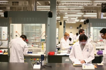 Medical students conduct research in a laboratory