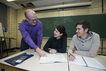 Photo of Greg Evans with students