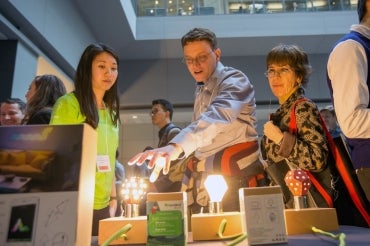 photo of conference attendees checking out Nanoleaf display