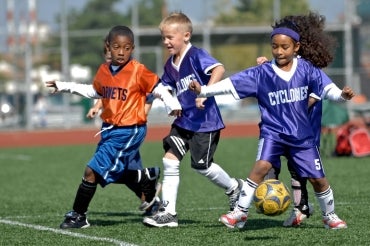 photo of kids playing soccer