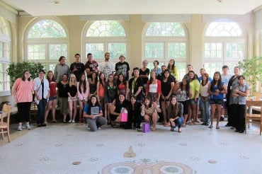 IYSP participants pose for a group photo with Amanda Carling