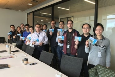 Photo of group with postcards