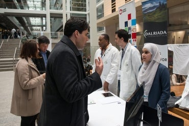 Photo of students at Startup Showcase booth