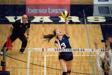 female athletes playing voleyball