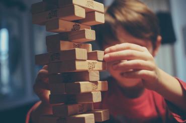 Photo of child playing Jenga