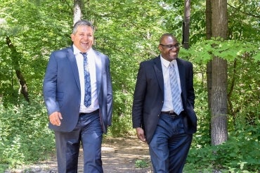 photo of Wisdom Tettey and Andrew Arifuzzaman walking on campus