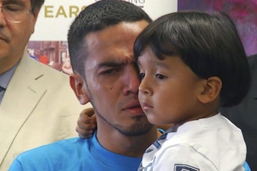 Photo of father and son reunited in U.S.
