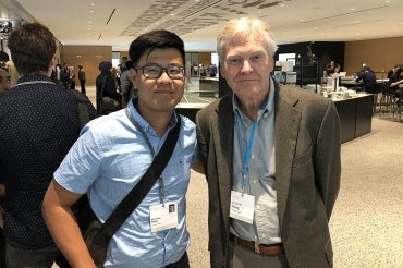 Photo of Kevin Wang with Nobel Laureate Michael Young