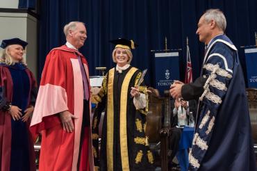 photo of William Downe shaking hands with President Gertler