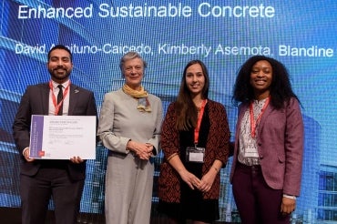 Kimberly Asemota (far right), Blandine Barthod (right) and David Aceituno-Caicedo (left) receive the SDSN Youth Special Prize in Geneva from Nane Annan, a lawyer and wife of the former UN secretary general