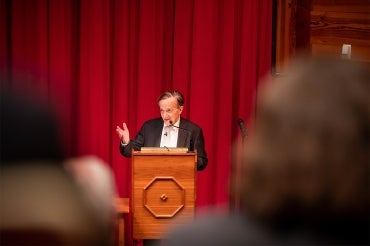 John Polanyi at the podium during the science for peace event