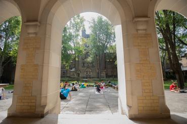 Students doing yoga on the St. George campus of the University of Toronto