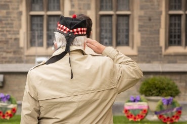 A veteran pays his respects during a Remembrance Day ceremony that was livestreamed to the public from Hart House on U of T's St. George campus (photo by Johnny Guatto)