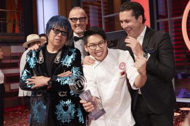 Christopher Siu holds the winner's trophy and poses with the masterchef judges