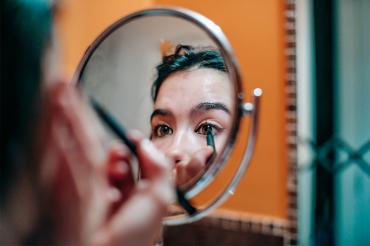 Woman doing her makeup