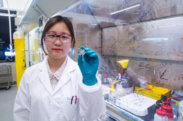 So Min Park holds up a sample of the perovskite solar cell