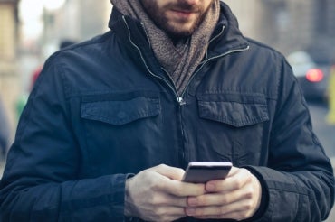 man looking at his phone