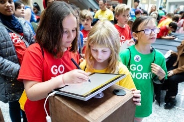 photo of children using a tablet