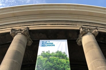 Photo of alumni reunion banner hanging from Convocation Hall