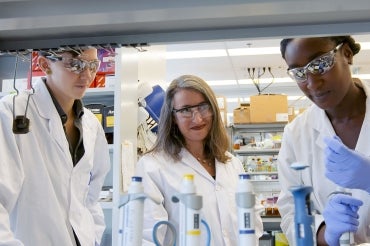 photo of Leah Cowen and other female researchers in a lab