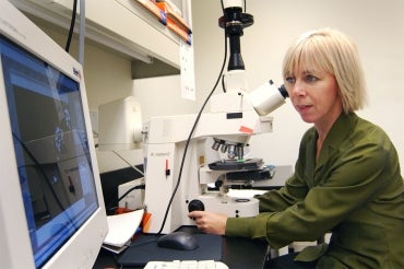 Portrait of Freda Miller in a lab at the Hosptial for Sick Children