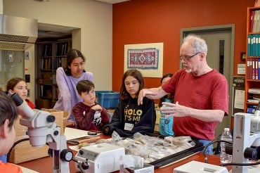 Professor Edward Banning of the department of anthropology with children