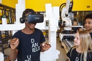 Photo of student wearing a VR headset