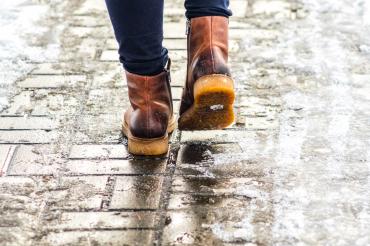 Man walking on icy sidewalk