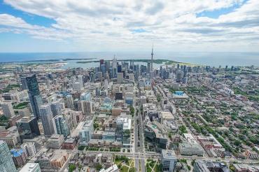 Aerial view of downtown toronto and the CN Tower looking towards the lake