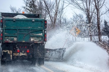 Snowplow plowing snow on a Peel Region street