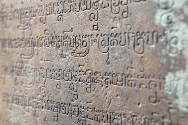 Temple wall in Cambodia with religious text engraved in sanskrit