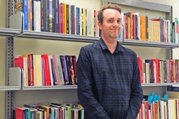 Copyright outreach librarian Graeme Slaght helps professors digitize their course material. (Photo by Romi Levine)