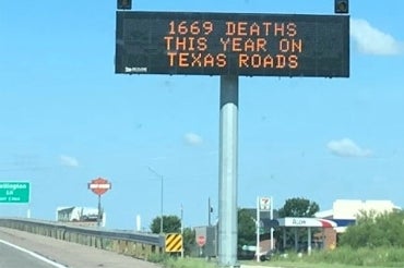 Highway sign in texas reads "1669 deaths this year on texas roads"