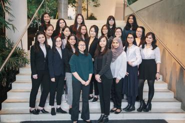 The organizing committee of the 2020 Women in Science and Engineering National Conference standing on a staircase