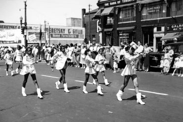archival image of young black cheerleaders in an emancipation day parade in windsor, on