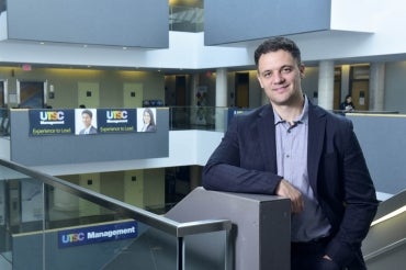 John Trougakos stands inside a building at University of Toronto Scarborough