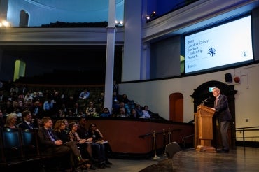 Photo of Gordon Cressy addressing award winners