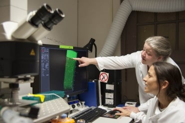 Tara Moriarty and student in a lab