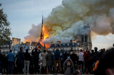 photo of the Notre Dame Cathedral in Paris as the roof burns