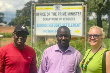 Photo of Carmen Logie, U of T PhD student Moses Okumu and Daniel Wakibi,