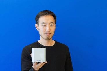Paul Lem holds up one of his Spartan cubes