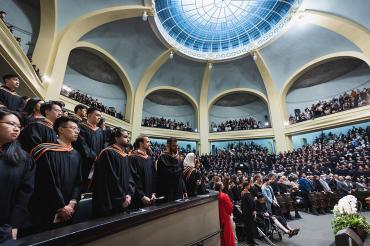 interior view of convocation hall showing graduands and the glass oculus