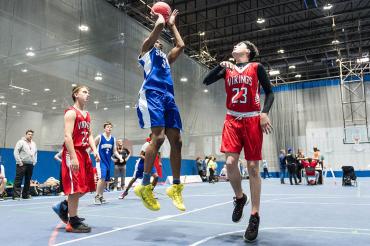 Photo of a Special Olympics athlete shooting a basketball