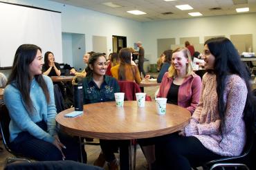 photo of students in the EEB mentorship program sitting around a table