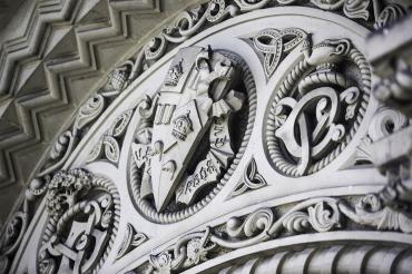 photo the university's crest, carved in stone