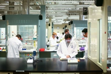 Photo of students doing research in a lab