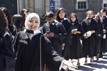 Graduands line up outside Simcoe Hall