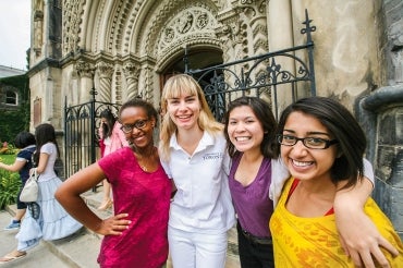 students with a tour guide at university college