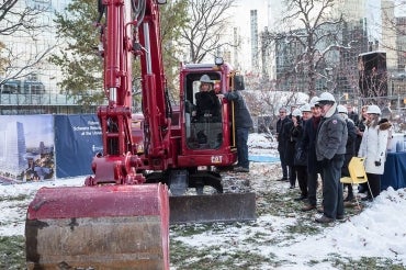 Heather Reisman operating a back hoe during the groundbreaking of the reisman schwartz innovation centre