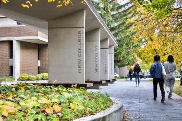 Students walking in front of New College at the University of Toronto St. George campus